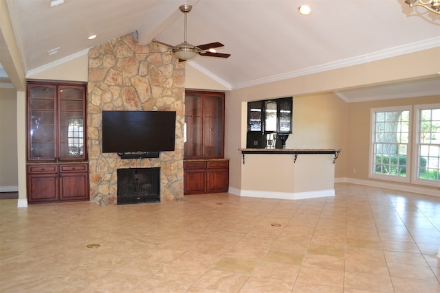 living room with a stone fireplace, vaulted ceiling with beams, ornamental molding, light tile patterned flooring, and ceiling fan