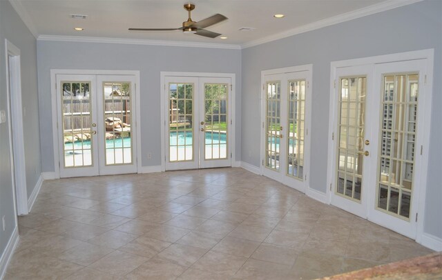 unfurnished sunroom featuring french doors and ceiling fan