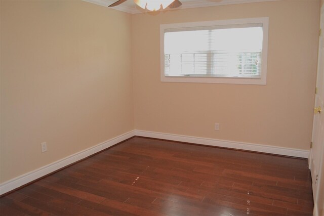 spare room with ceiling fan, dark hardwood / wood-style floors, and ornamental molding