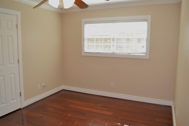 empty room with dark hardwood / wood-style flooring, ceiling fan, and crown molding