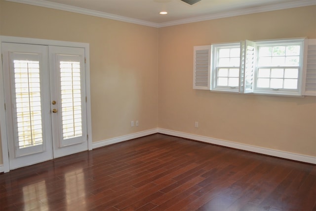 empty room featuring ornamental molding, a wealth of natural light, french doors, and dark hardwood / wood-style floors