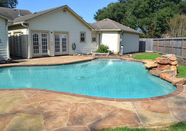 view of swimming pool with a patio