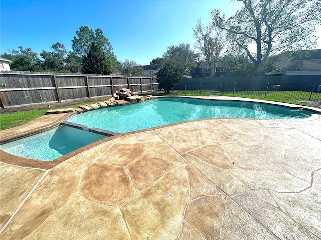 view of pool featuring a patio area