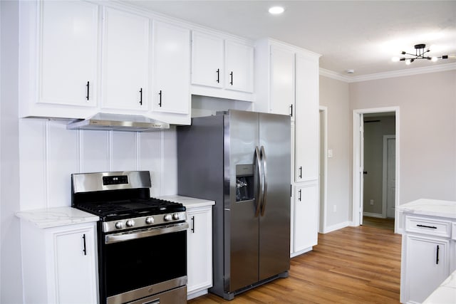 kitchen featuring extractor fan, white cabinets, and stainless steel appliances