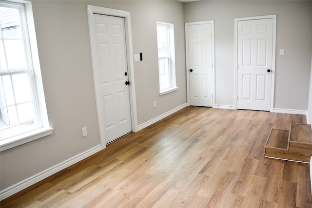 entryway with light wood-type flooring and plenty of natural light