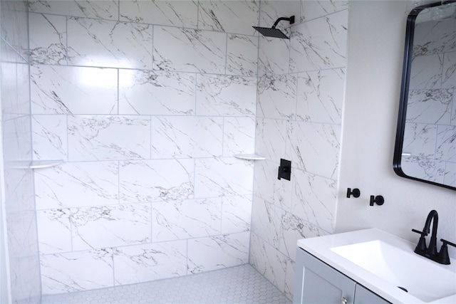 bathroom featuring vanity and tiled shower