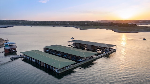 aerial view at dusk with a water view