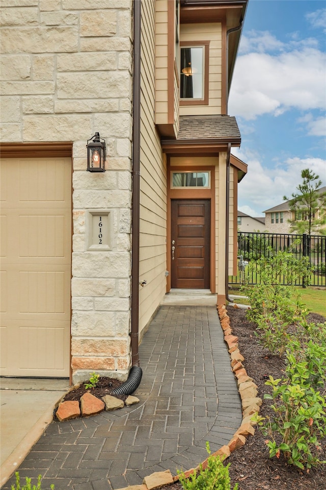 property entrance with a garage