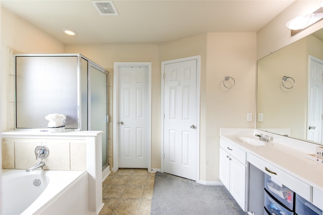 bathroom with vanity and separate shower and tub