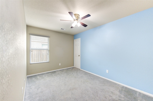 carpeted empty room with ceiling fan