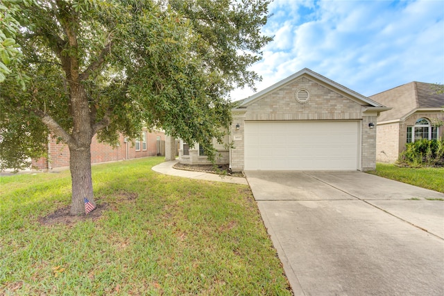 view of front of property featuring a garage and a front lawn