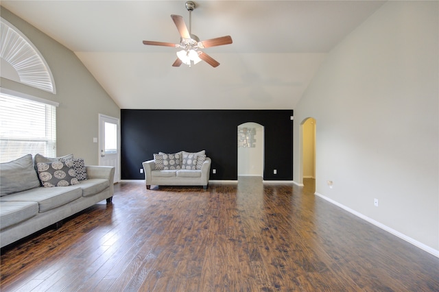 unfurnished living room featuring dark wood-type flooring, ceiling fan, and vaulted ceiling