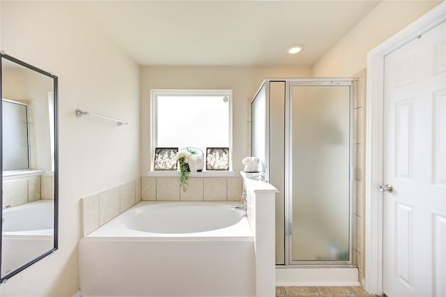 bathroom with shower with separate bathtub