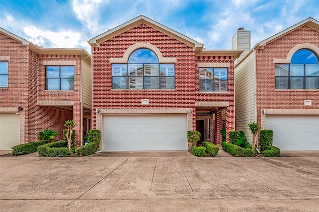 multi unit property featuring a garage