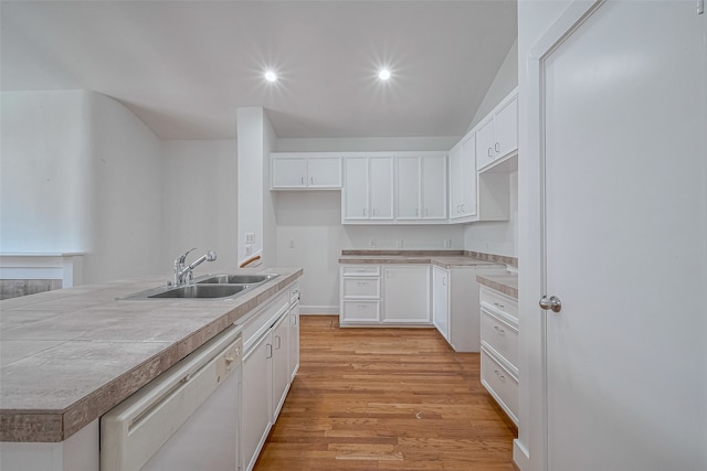 kitchen with white cabinetry, white dishwasher, sink, tile countertops, and light hardwood / wood-style flooring