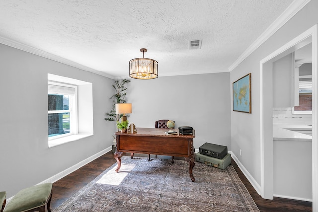 office space with dark hardwood / wood-style flooring, a textured ceiling, a notable chandelier, and crown molding