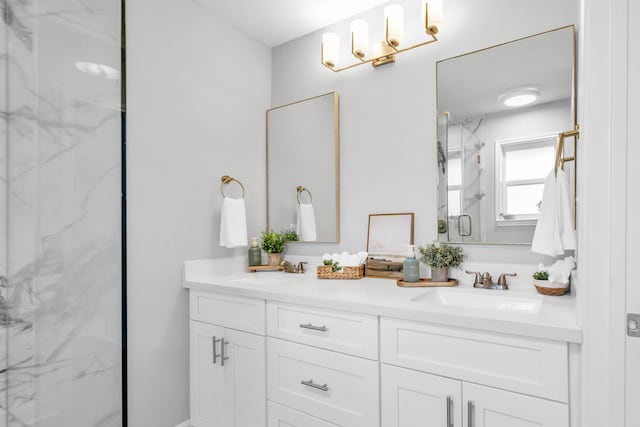 bathroom with vanity and a shower with shower door