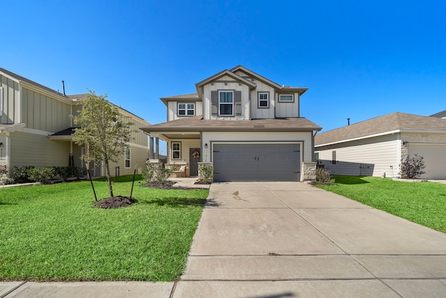 view of front of property with a garage and a front lawn