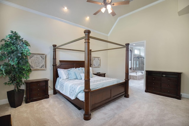 carpeted bedroom with ensuite bathroom, crown molding, ceiling fan, and high vaulted ceiling