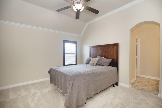 carpeted bedroom featuring vaulted ceiling, ceiling fan, and ornamental molding