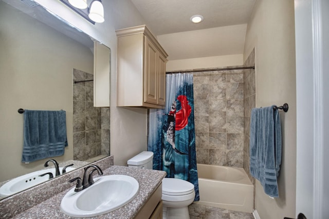 full bathroom featuring shower / bath combination with curtain, toilet, and vanity