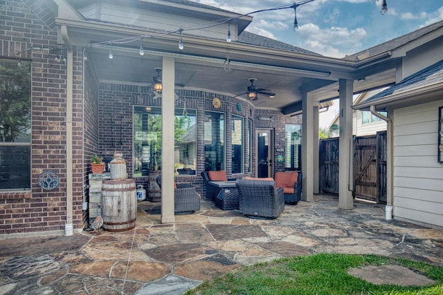 view of patio with ceiling fan and an outdoor living space