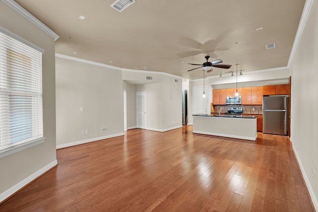 unfurnished living room featuring ceiling fan, light hardwood / wood-style flooring, and crown molding