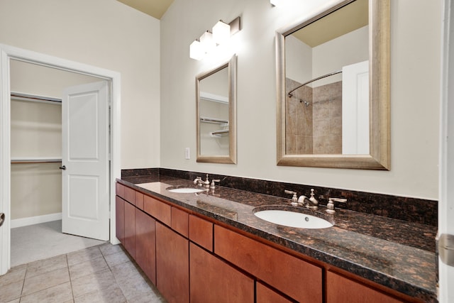 bathroom featuring tile patterned flooring and vanity