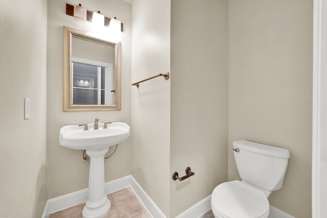 bathroom featuring tile patterned flooring and toilet