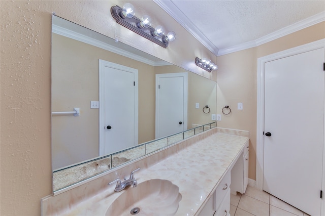 bathroom featuring vanity, tile patterned floors, a textured ceiling, and crown molding