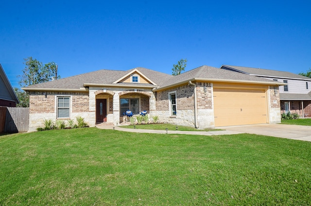 view of front of house featuring a garage and a front lawn