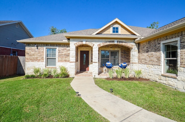 view of front of home featuring a porch and a front yard