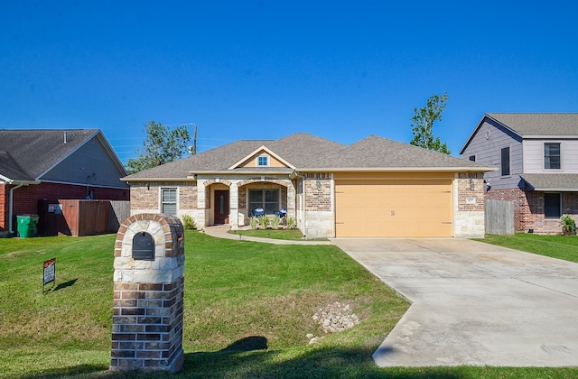 view of front facade featuring a garage and a front yard