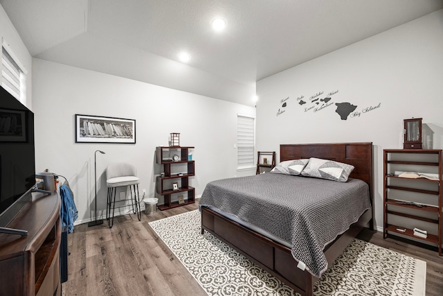 bedroom with hardwood / wood-style floors