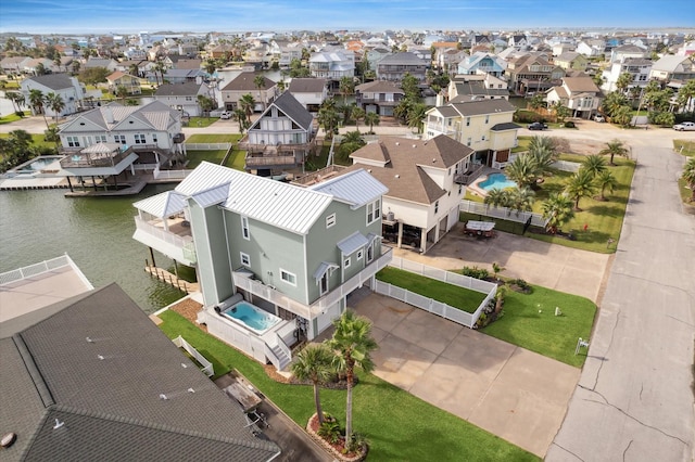 1335 Outrigger, Tiki Island, TX 77554 - aerial view of residential area featuring a pool area and a large body of water