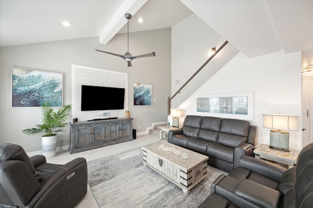 living room with beamed ceiling, ceiling fan, light hardwood / wood-style floors, and high vaulted ceiling