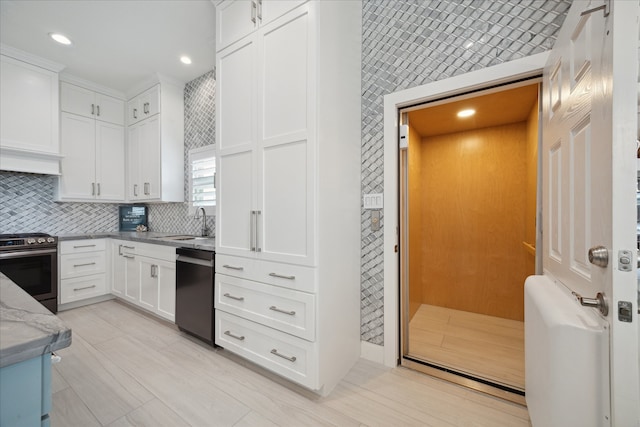 kitchen with stainless steel range with electric cooktop, sink, light stone countertops, black dishwasher, and white cabinetry