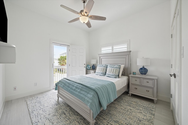 bedroom featuring access to outside, ceiling fan, and light hardwood / wood-style floors