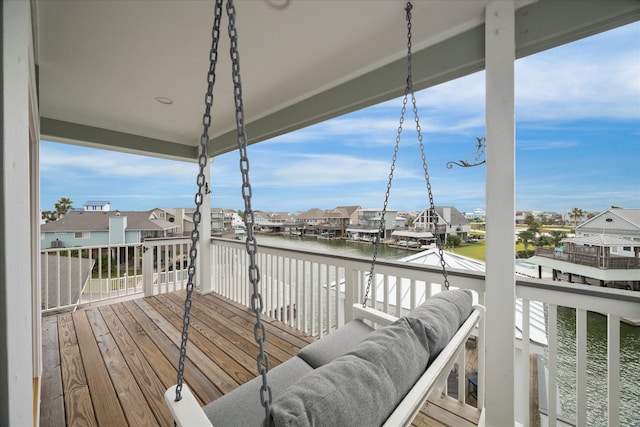 wooden terrace with a water view