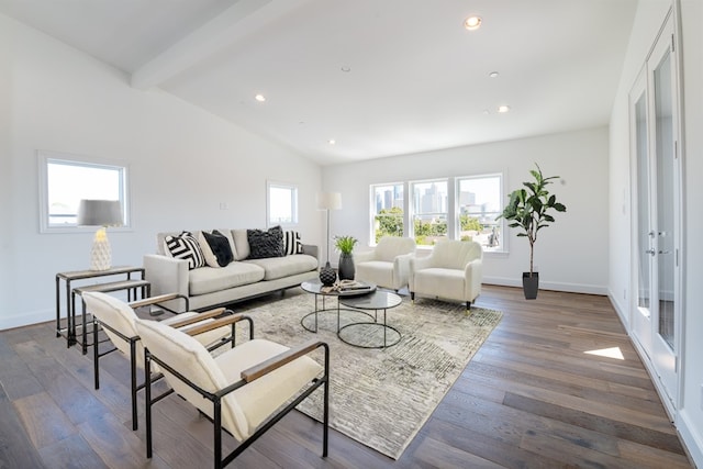 living room with french doors, plenty of natural light, dark wood-type flooring, and vaulted ceiling with beams