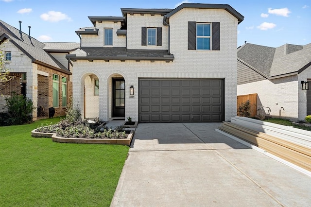 view of front of home with a garage, a front lawn, concrete driveway, and brick siding