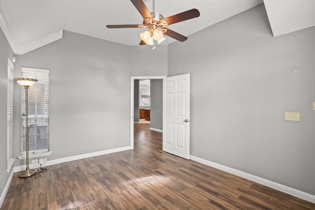 unfurnished room featuring dark wood-type flooring, ceiling fan, and high vaulted ceiling