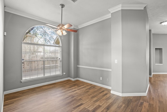 unfurnished dining area featuring ceiling fan, dark hardwood / wood-style floors, and ornamental molding