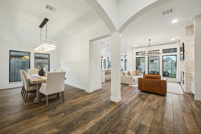 dining room featuring a notable chandelier and dark hardwood / wood-style floors