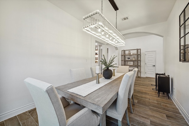 dining room with dark hardwood / wood-style floors