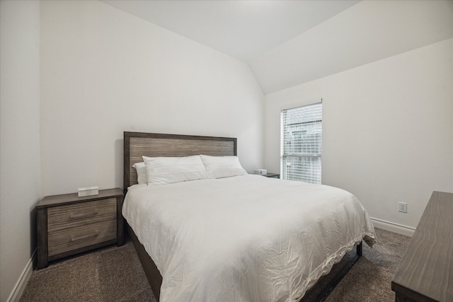 carpeted bedroom featuring vaulted ceiling