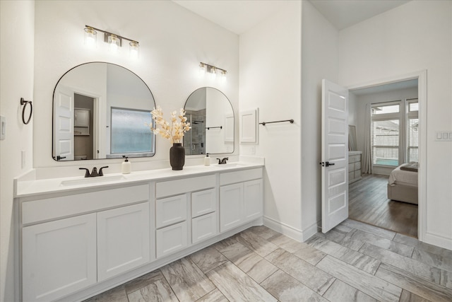 bathroom with wood-type flooring and vanity