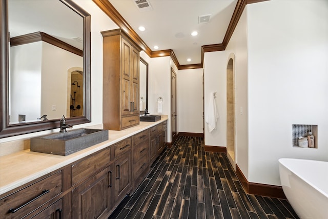 bathroom with hardwood / wood-style floors, vanity, ornamental molding, and independent shower and bath