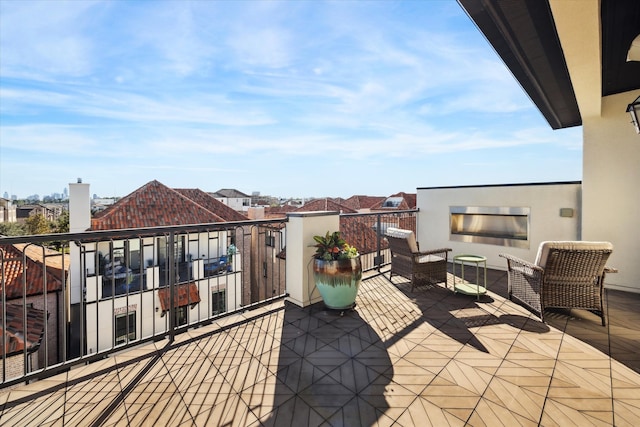 view of patio featuring a balcony