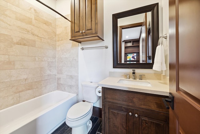 full bathroom with vanity, toilet, and tiled shower / bath